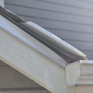 Temporary water diverters are creating gaps allowing wind-driven rain to easily enter the structure itself.